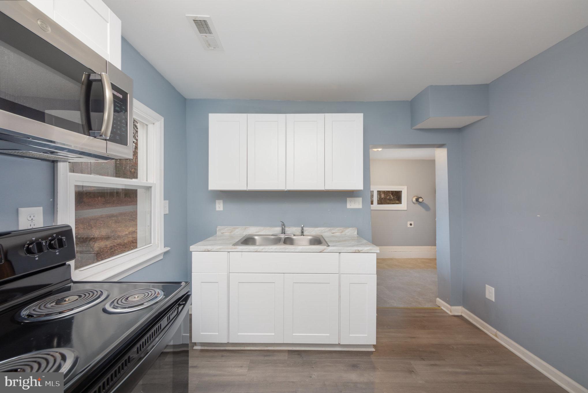 9003 Smiths Bend Road Fredericksburg, VA 22407 - Photo 7 of 22 a utility room with sink dryer and washer