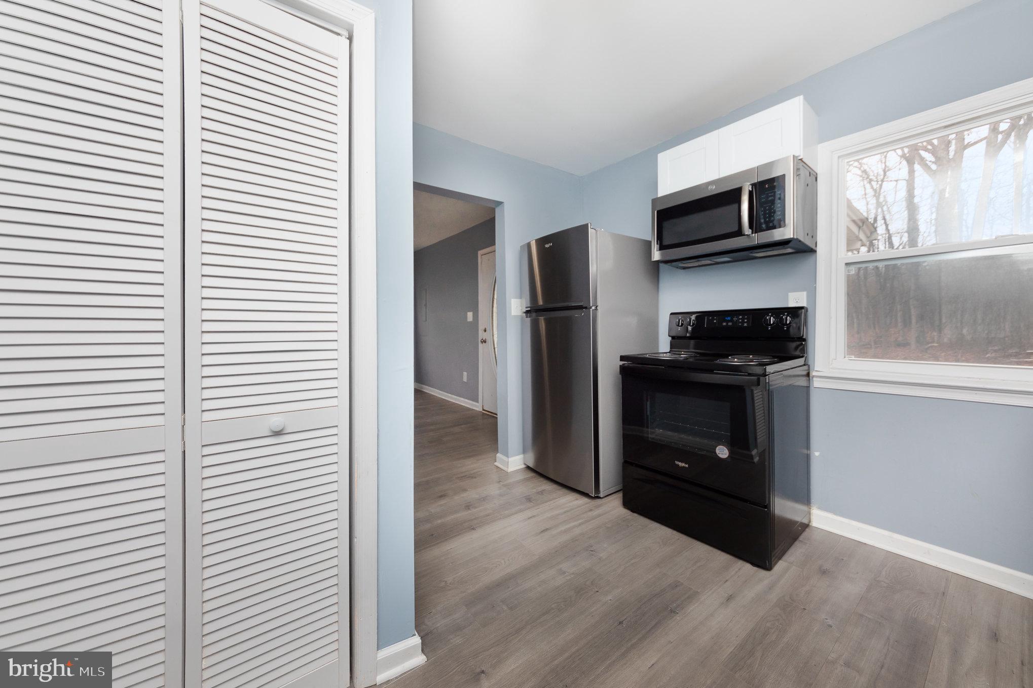 9003 Smiths Bend Road Fredericksburg, VA 22407 - Photo 8 of 22 a kitchen with a refrigerator and a stove