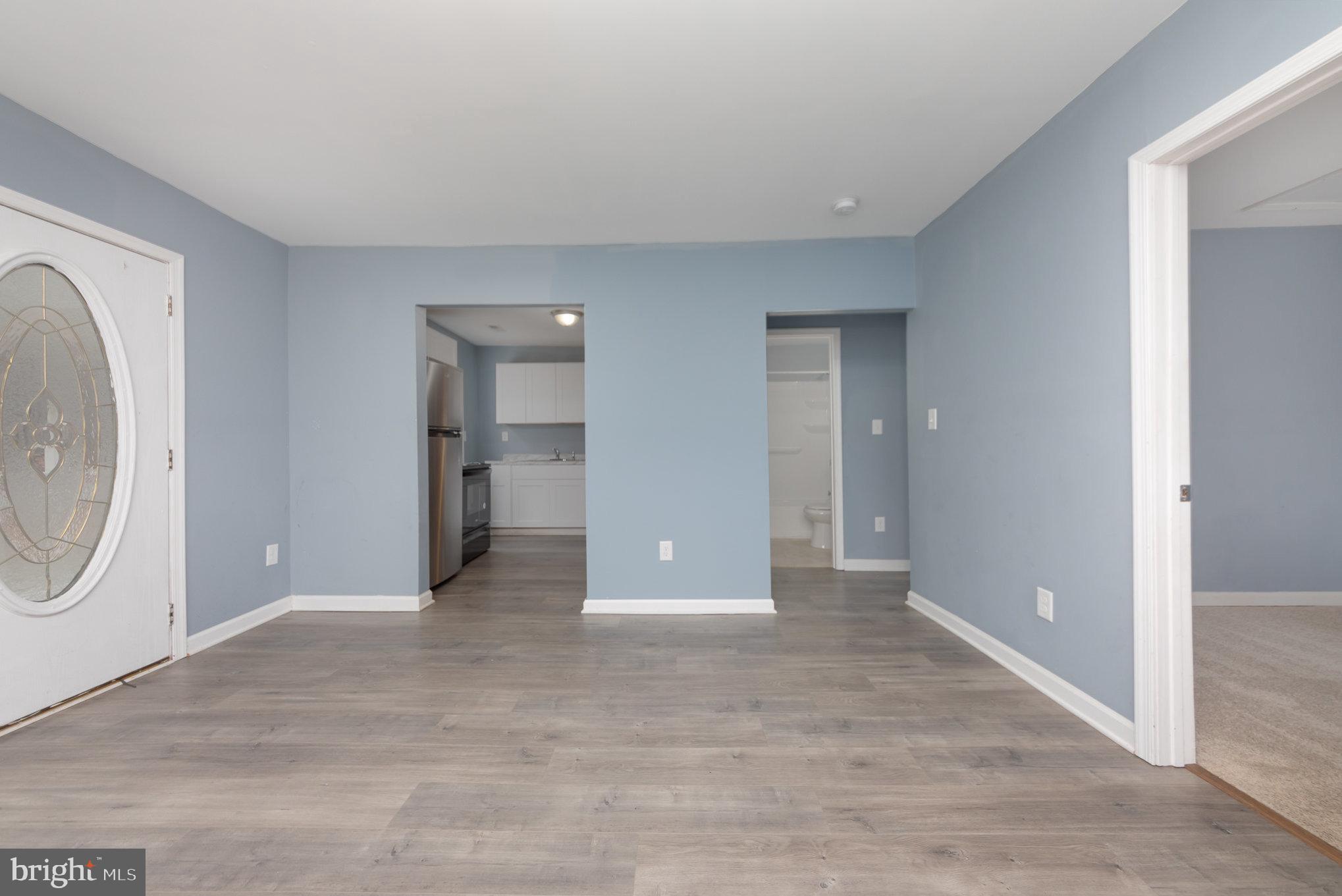 9003 Smiths Bend Road Fredericksburg, VA 22407 - Photo 9 of 22 a view of a big room with entryway and wooden floor