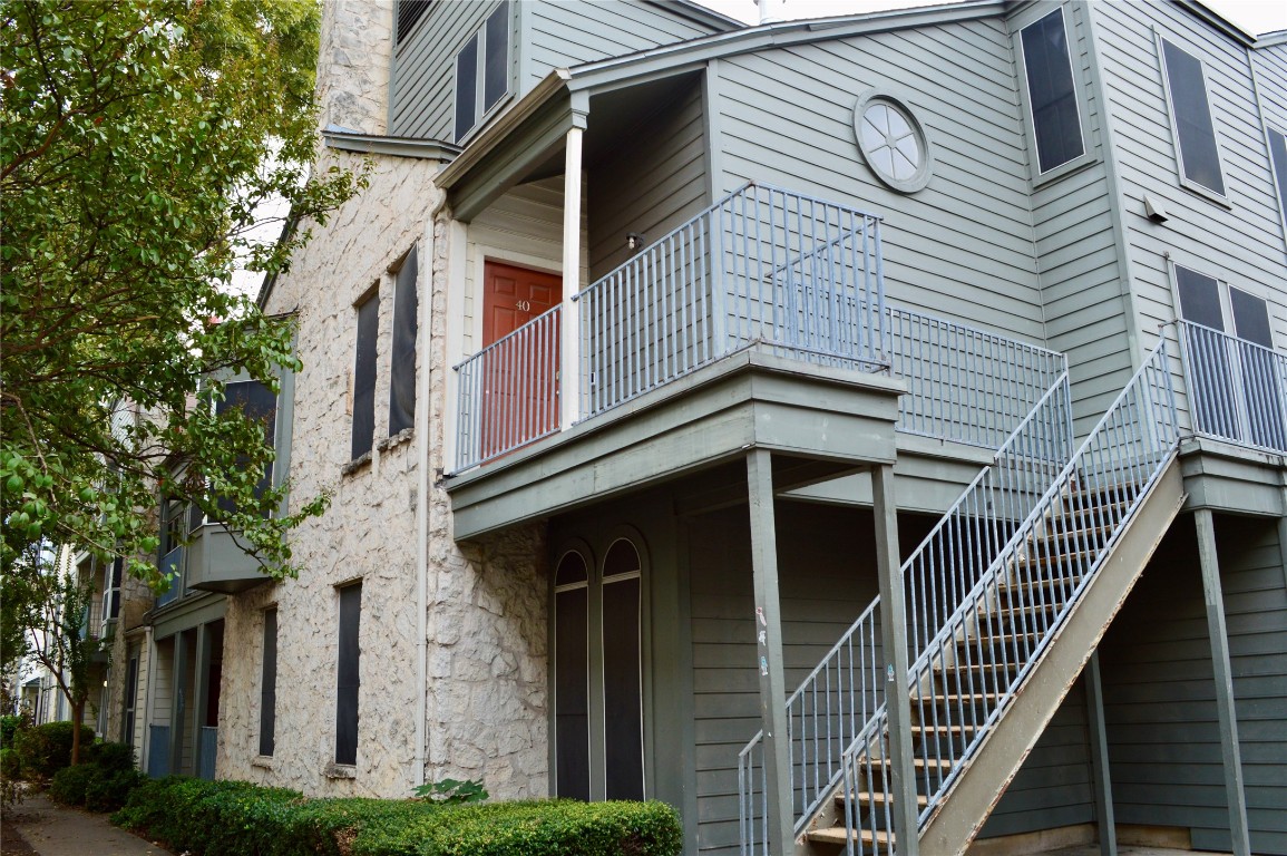2529 Rio Grande Street, Unit 13 Austin, TX 78705 - Photo 9 of 10 a front view of a house with a iron stairs