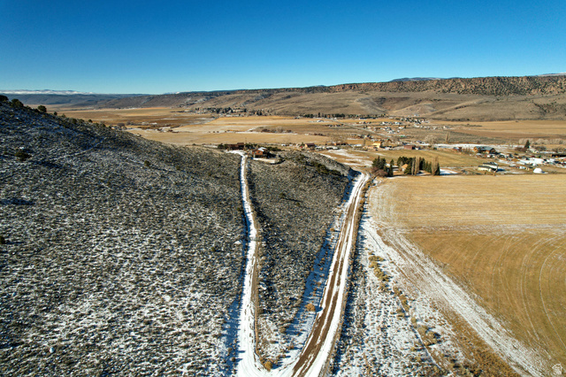 1208 East Tidwell Road Loa, UT 84747 - Photo 4 of 40 Aerial view of sparsely populated area featuring a mountain backdrop