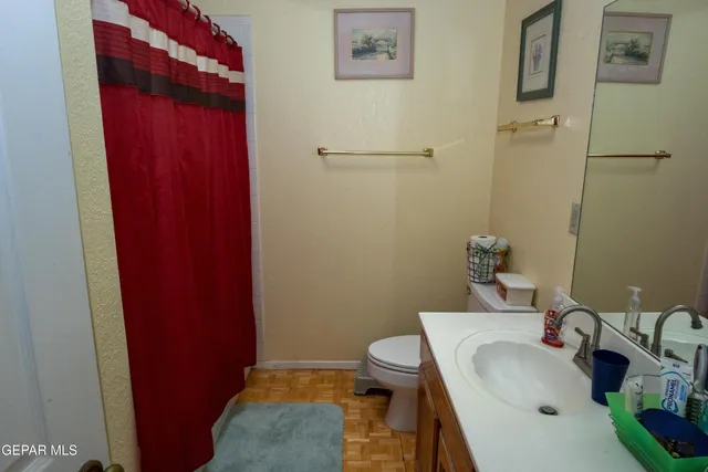 a bed room with a bed and a television