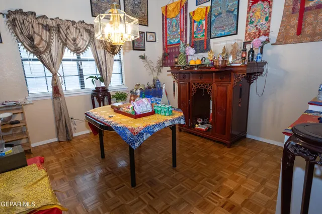 a dining room with furniture and window