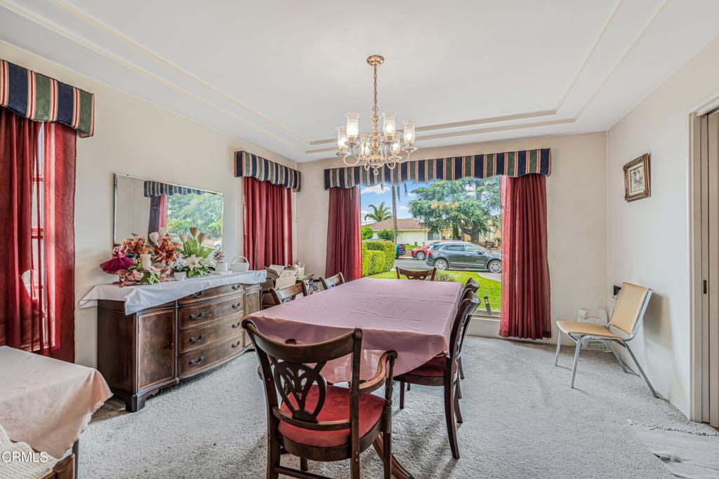 336 Doris Avenue Oxnard, CA 93030 - Photo 13 of 44 a dining room with furniture a chandelier and window