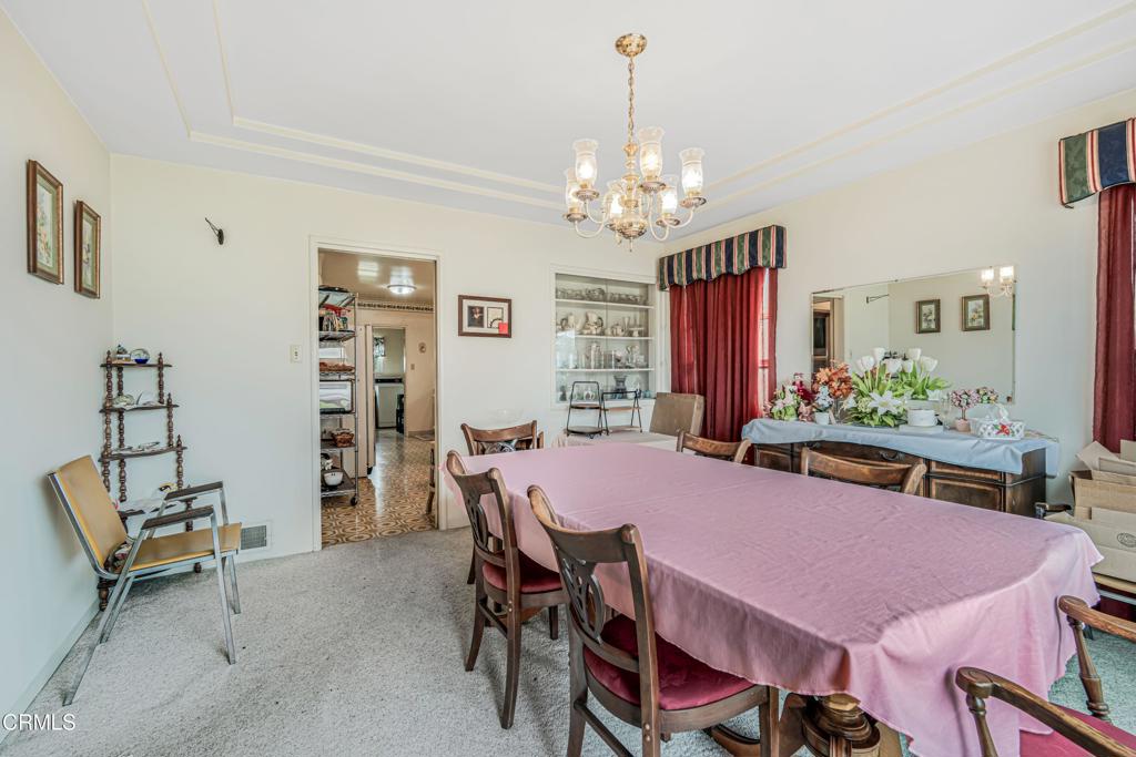 336 Doris Avenue Oxnard, CA 93030 - Photo 14 of 44 a view of a dining room with furniture and chandelier