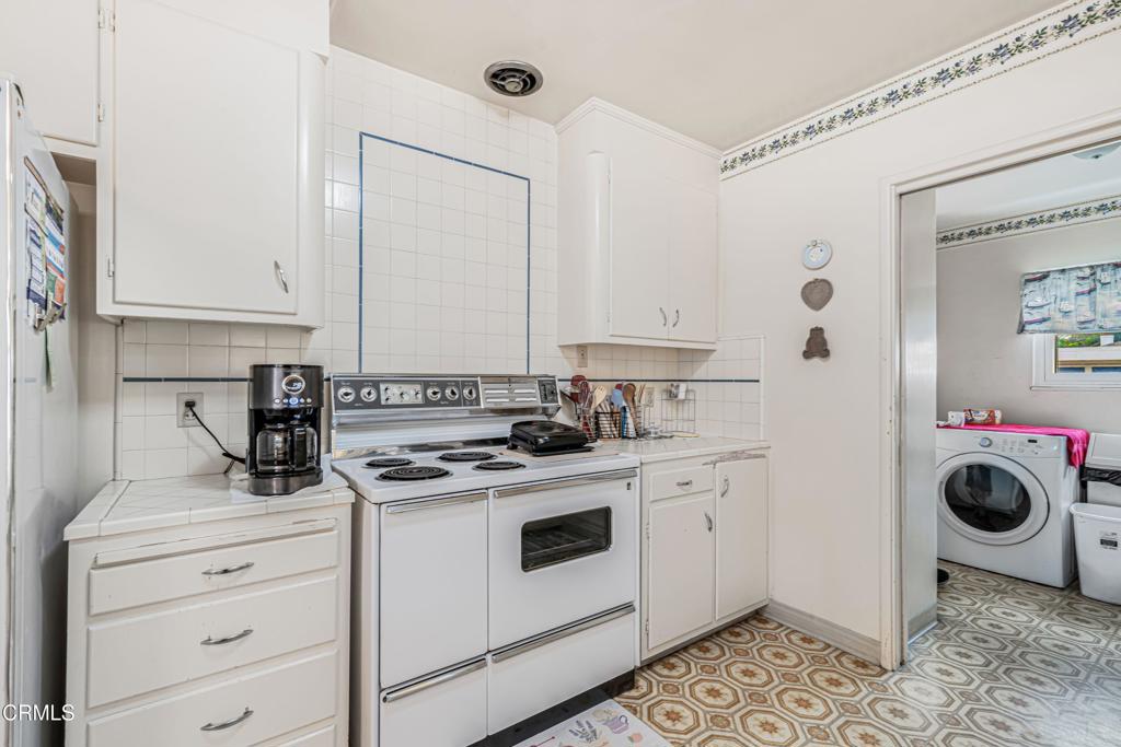 336 Doris Avenue Oxnard, CA 93030 - Photo 20 of 44 a view of cabinets a washer and dryer