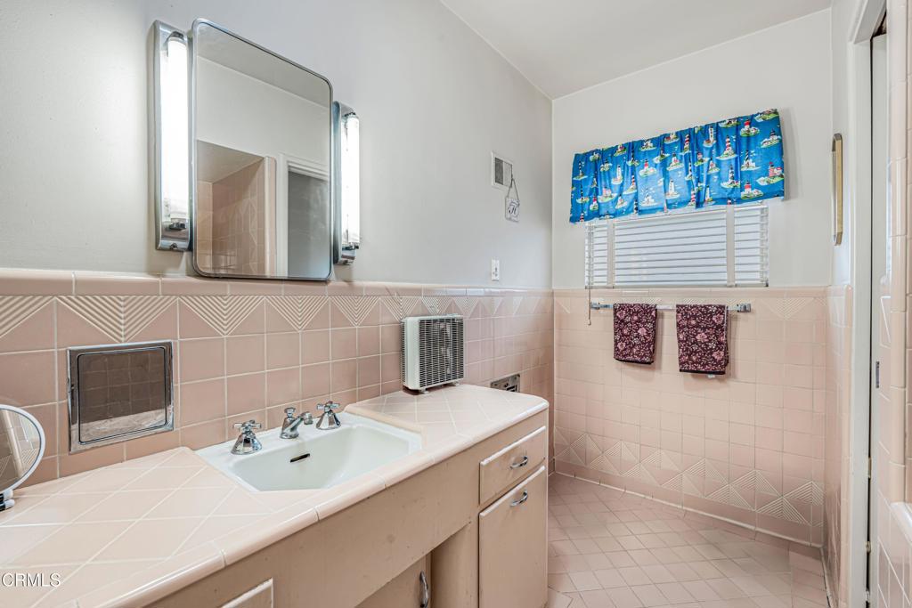 336 Doris Avenue Oxnard, CA 93030 - Photo 28 of 44 a bathroom with a sink and a mirror