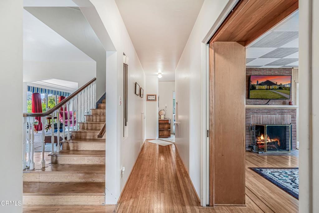 336 Doris Avenue Oxnard, CA 93030 - Photo 8 of 44 a view of a hallway to a livingroom and a fireplace