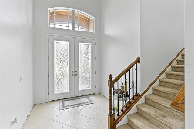 a bed room with a bed and a large window