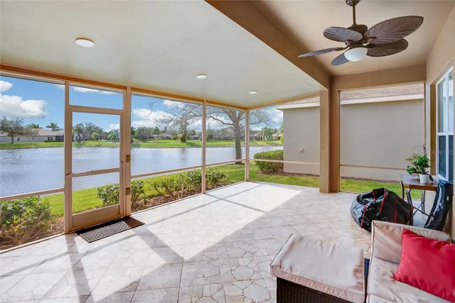 a view of an empty room with a floor to ceiling window and an outdoor view