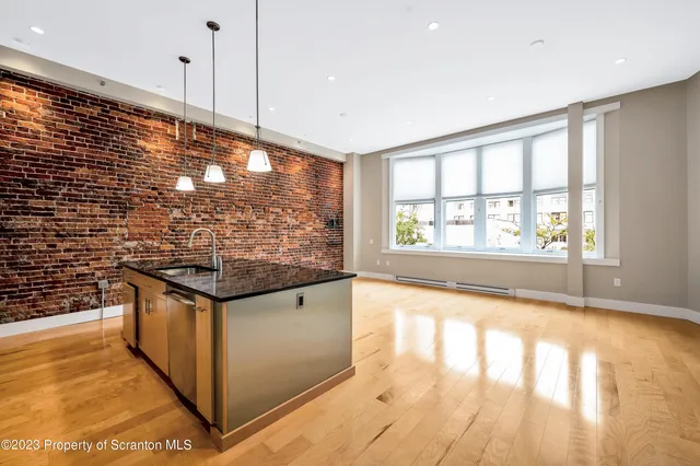 an empty room with large window