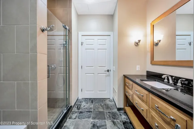 a bathroom with a tub a toilet and a shower