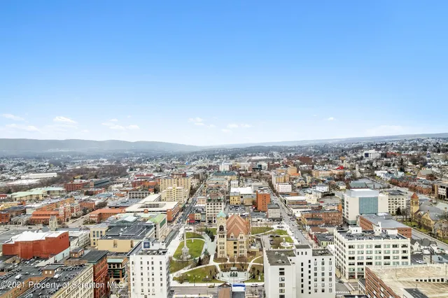 an aerial view of residential building with parking space