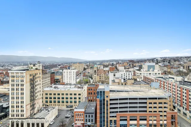 a view of a city with tall buildings