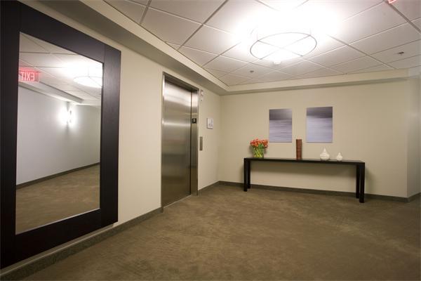 1910 Dorchester Avenue, Unit 517 Boston, MA 02124 - Photo 3 of 15 a bedroom with furniture and a potted plant