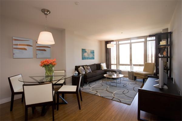 1910 Dorchester Avenue, Unit 517 Boston, MA 02124 - Photo 4 of 15 a living room with furniture a window and a table