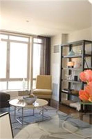 1910 Dorchester Avenue, Unit 517 Boston, MA 02124 - Photo 6 of 15 a living room with furniture window and wooden floor