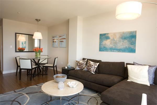 1910 Dorchester Avenue, Unit 517 Boston, MA 02124 - Photo 7 of 15 a living room with furniture and wooden floor