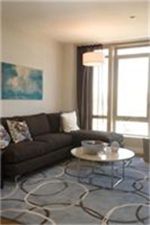 1910 Dorchester Avenue, Unit 517 Boston, MA 02124 - Photo 8 of 15 a living room with furniture and a large window