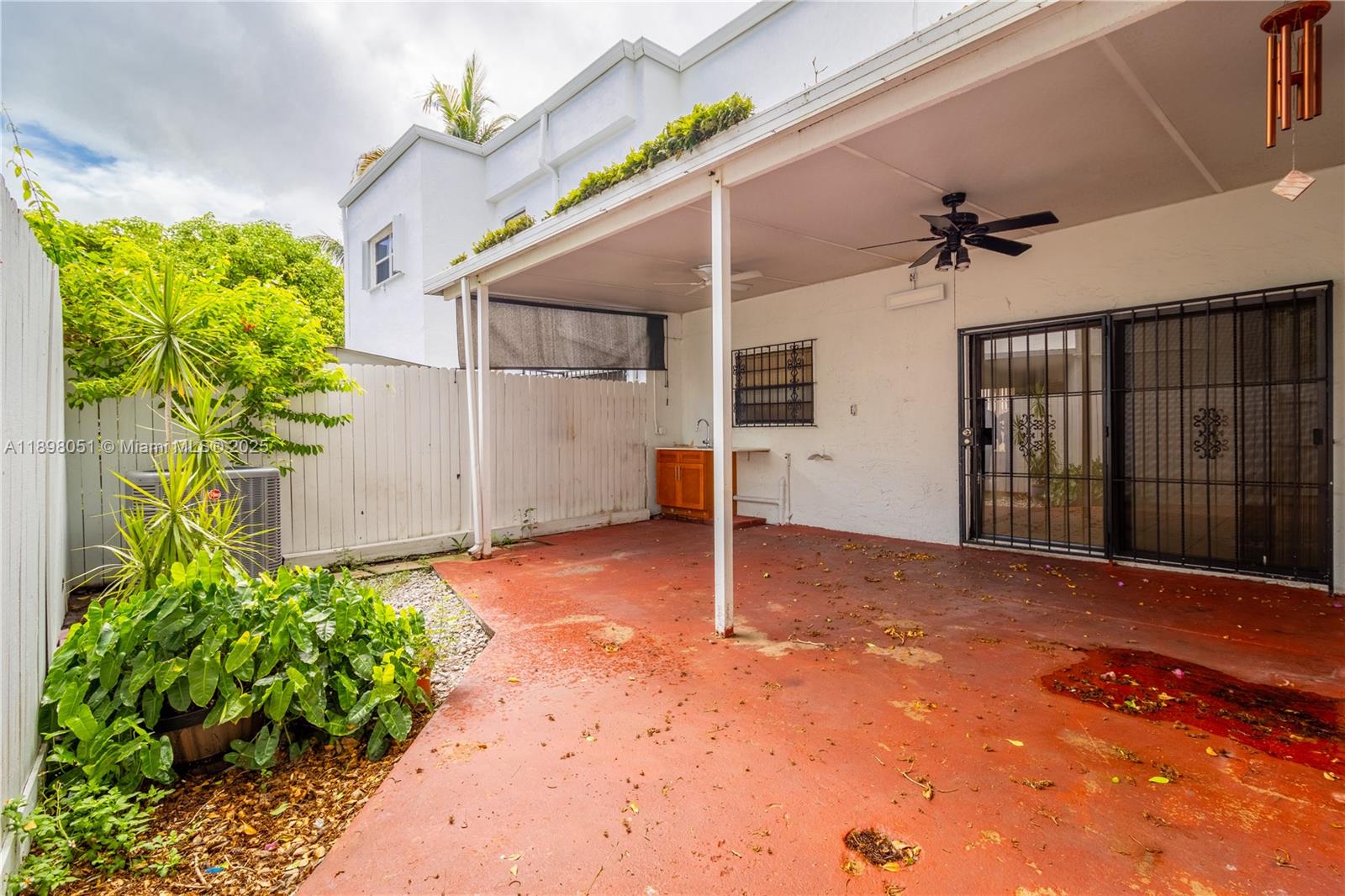 217 Northwest 109th Avenue, Unit 2217 Miami, FL 33172 - Photo 17 of 19 a view of a house with a yard