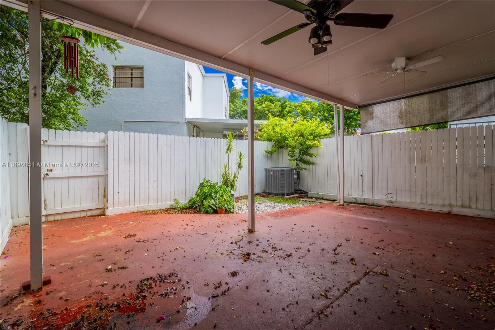 217 Northwest 109th Avenue, Unit 2217 Miami, FL 33172 - Photo 18 of 19 a backyard of a house with a patio