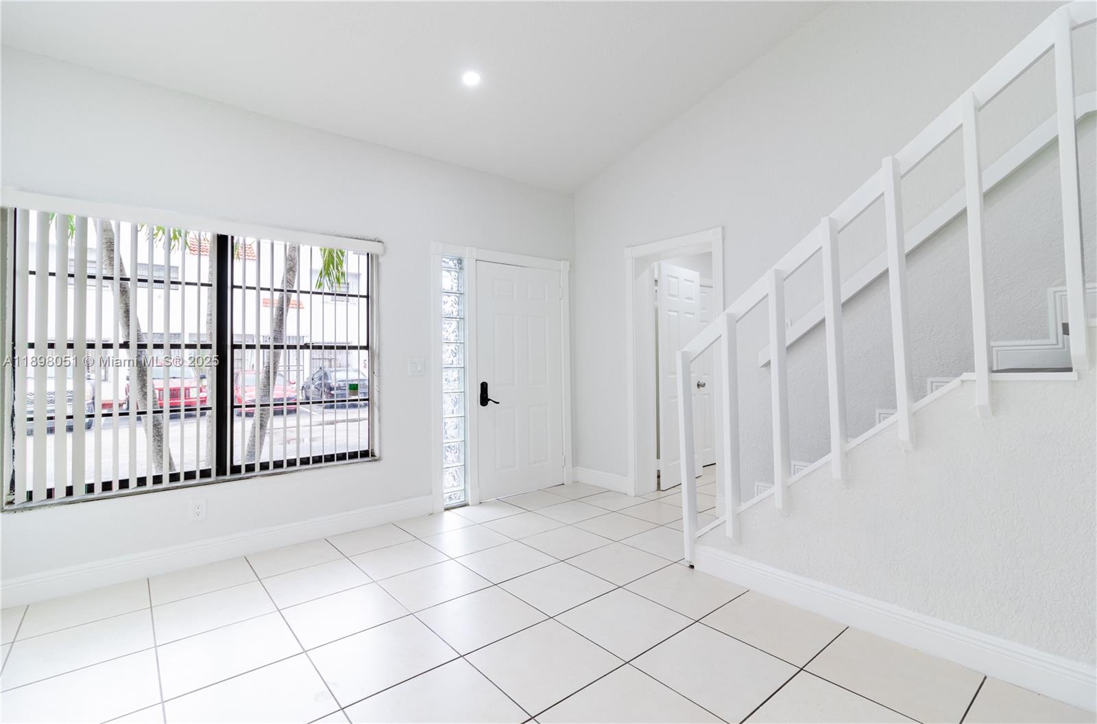 217 Northwest 109th Avenue, Unit 2217 Miami, FL 33172 - Photo 2 of 19 a view of entryway with stairs