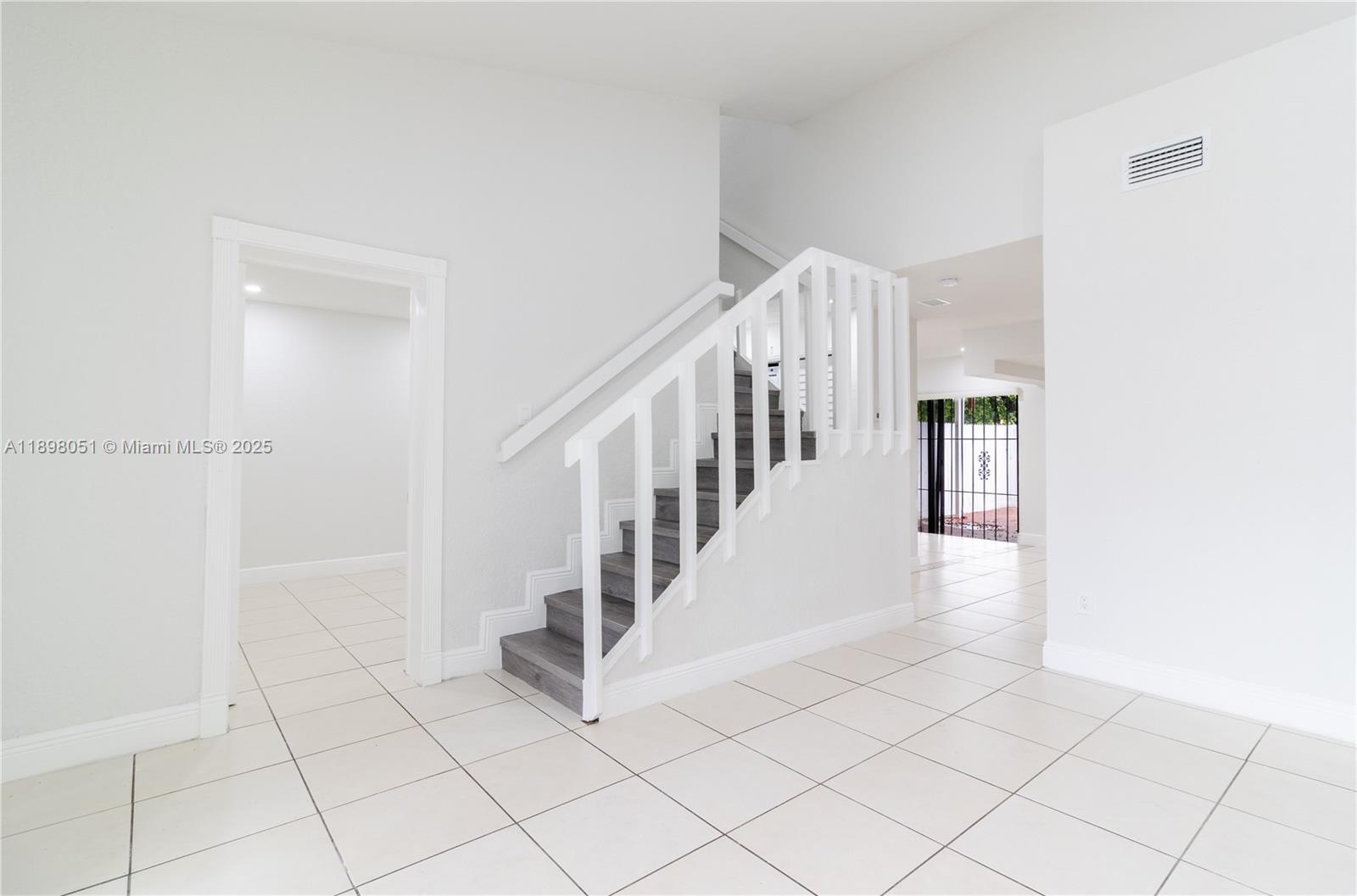 217 Northwest 109th Avenue, Unit 2217 Miami, FL 33172 - Photo 3 of 19 a view of an entryway with stairs