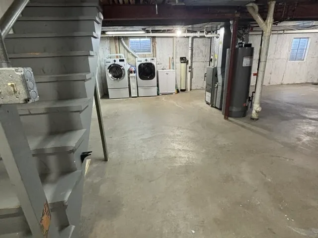 a bathroom with a sink mirror and toilet