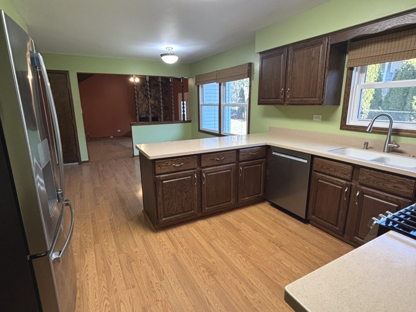 4705 Elm Street Lisle, IL 60532 - Photo 7 of 20 a kitchen with stainless steel appliances granite countertop a sink stove and refrigerator