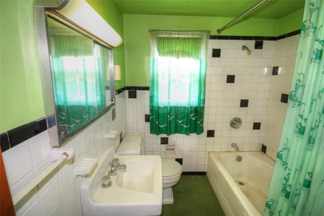 a bathroom with a bathtub and a sink