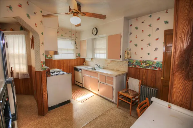 a kitchen with sink cabinets and window