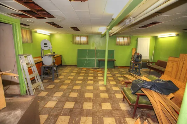 a view of a patio with table and chairs