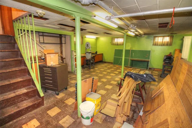 a view of a porch with a table and chairs