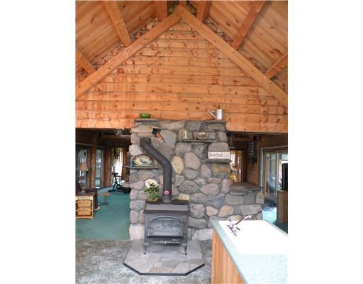 91 Ostrom Road Bowerbank, ME 04426 - Photo 9 of 25 Kitchen. wood stove in Kitchen