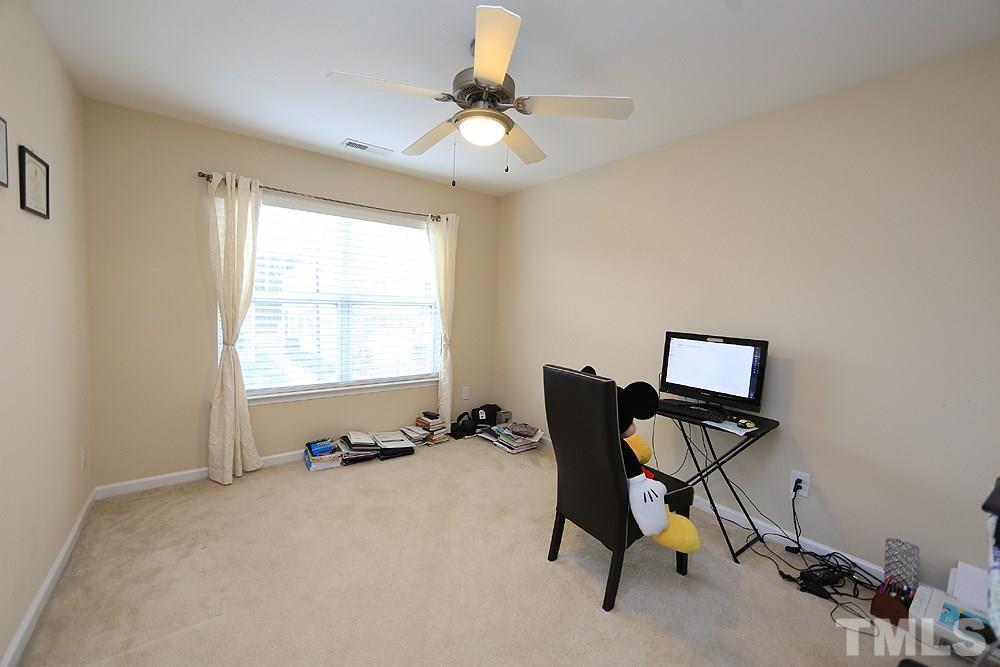 2422 Memory Ridge Drive Raleigh, NC 27606 - Photo 14 of 19 a room with gym equipment and a window