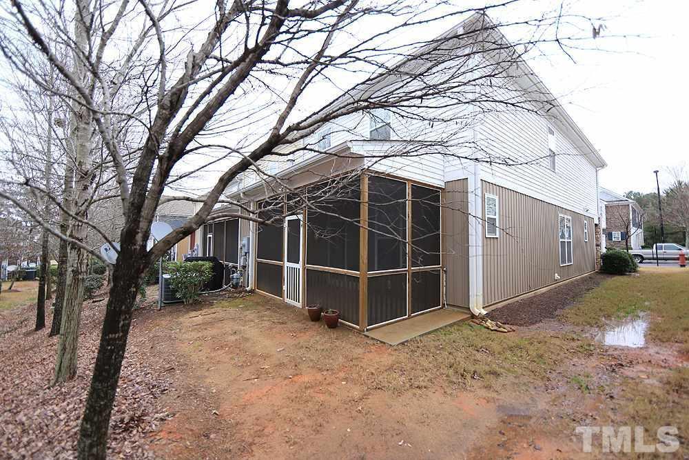 2422 Memory Ridge Drive Raleigh, NC 27606 - Photo 17 of 19 a view of a backyard with a large tree