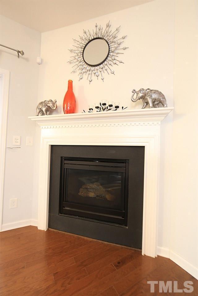 2422 Memory Ridge Drive Raleigh, NC 27606 - Photo 8 of 19 a view of fireplace with washer and dryer