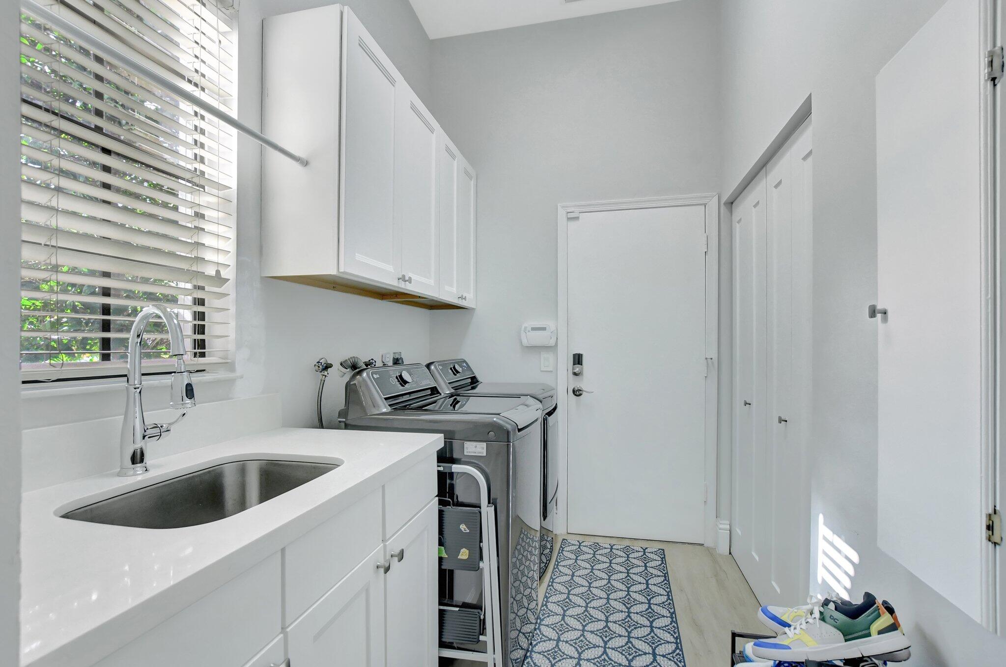 6364 Northwest 25th Way Boca Raton, FL 33496 - Photo 39 of 39 Laundry leading to garage
