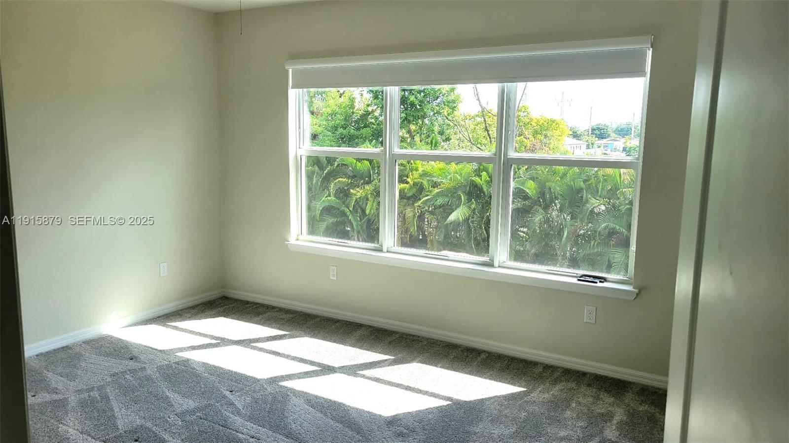 4164 Ficus Street Hollywood, FL 33021 - Photo 13 of 16 a view of an empty room and window