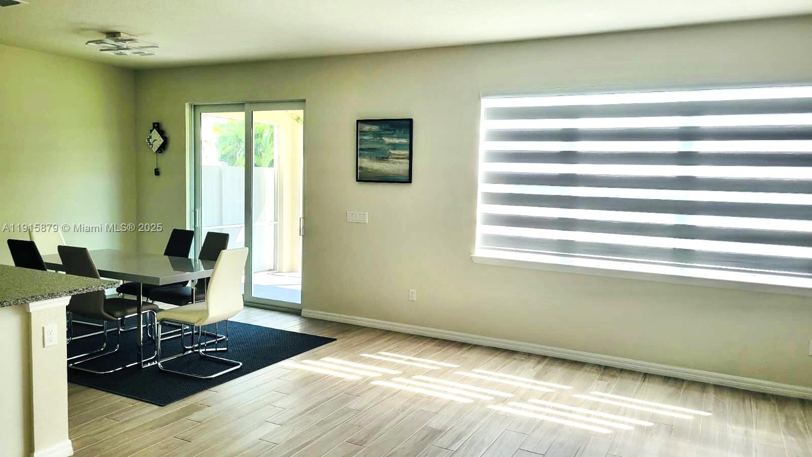 4164 Ficus Street Hollywood, FL 33021 - Photo 14 of 16 a workspace with furniture and a window