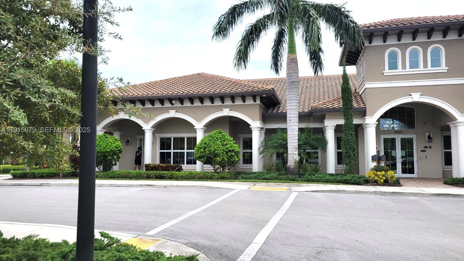 4164 Ficus Street Hollywood, FL 33021 - Photo 3 of 16 front view of a house with a garden