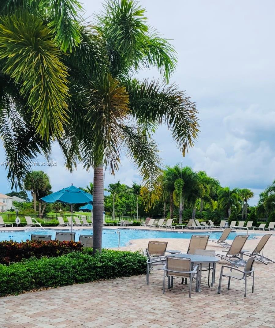4164 Ficus Street Hollywood, FL 33021 - Photo 4 of 16 a backyard of a house with a garden and outdoor seating