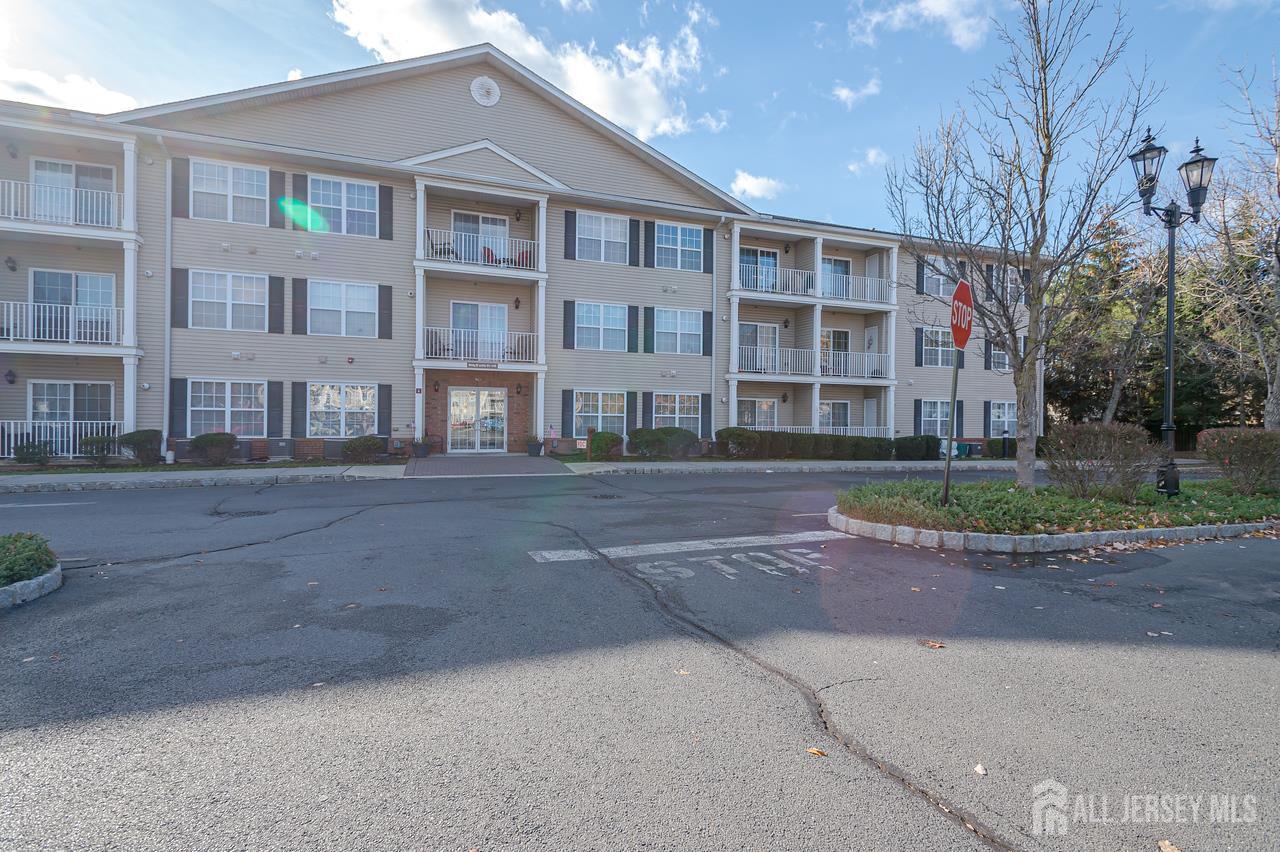 99 Liddle Avenue Edison, NJ 08837 - Photo 1 of 15 a front view of residential houses with street