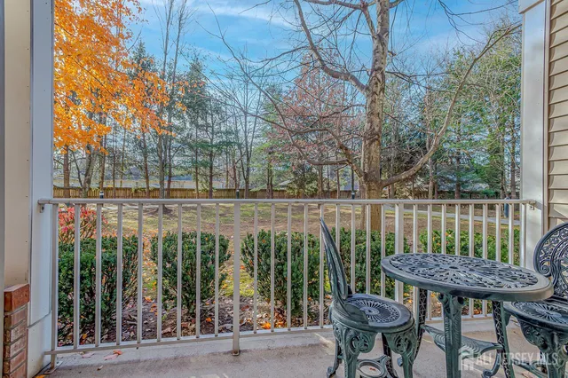 a view of a chair and table in the balcony