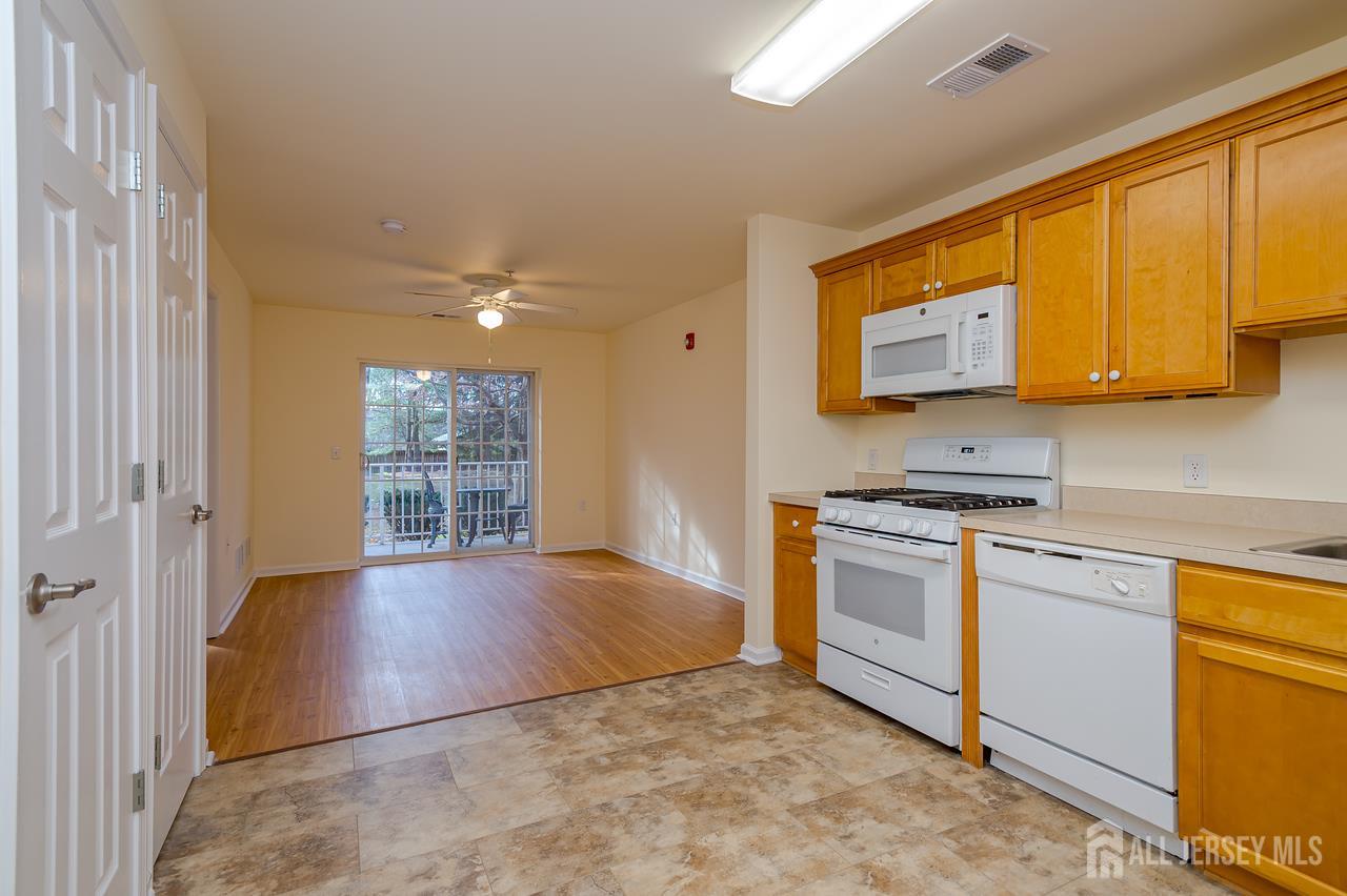 99 Liddle Avenue Edison, NJ 08837 - Photo 4 of 15 a view of a kitchen with microwave and a sink