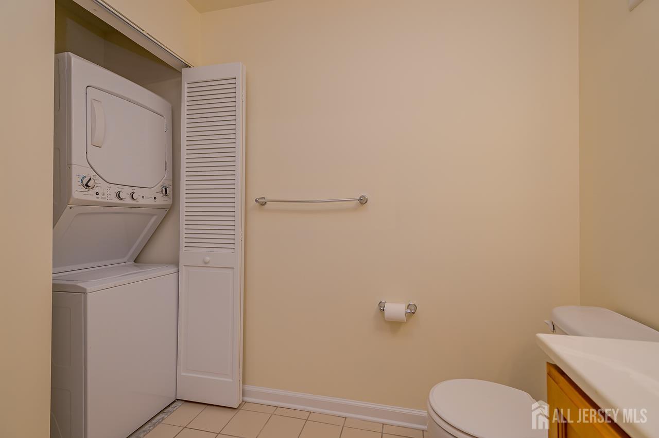 99 Liddle Avenue Edison, NJ 08837 - Photo 8 of 15 a white toilet sitting next to a shower