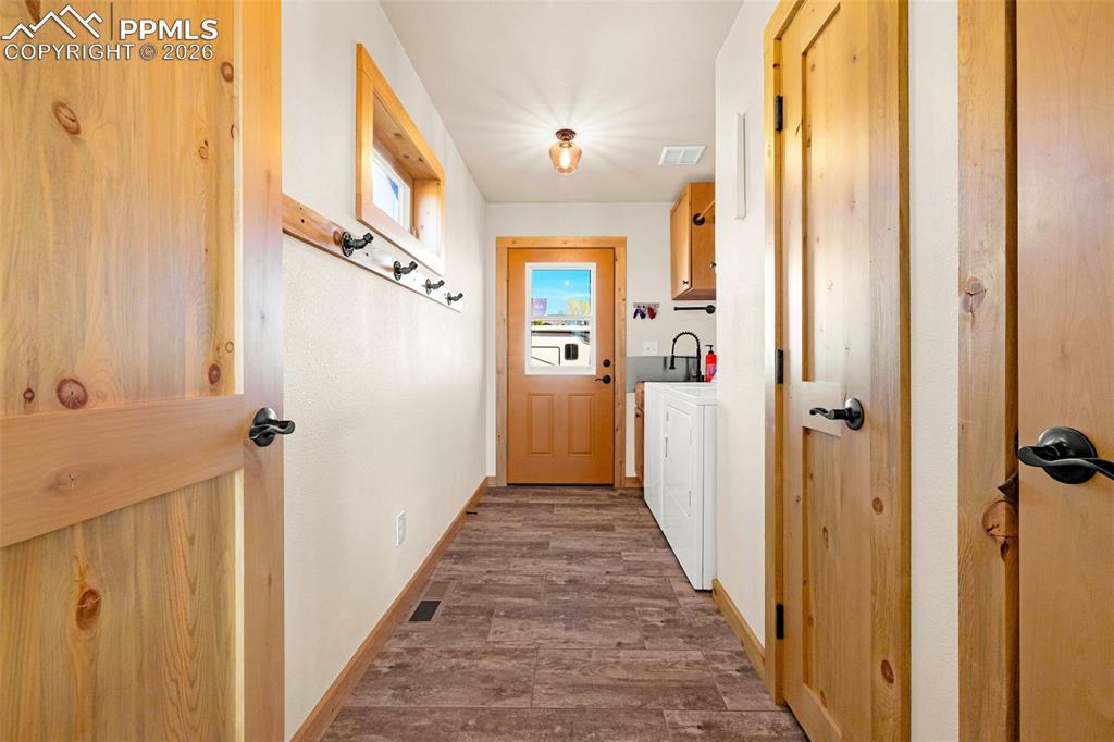 8480 Delaware Road Colorado Springs, CO 80926 - Photo 19 of 49 Laundry room located on main level with side entry door