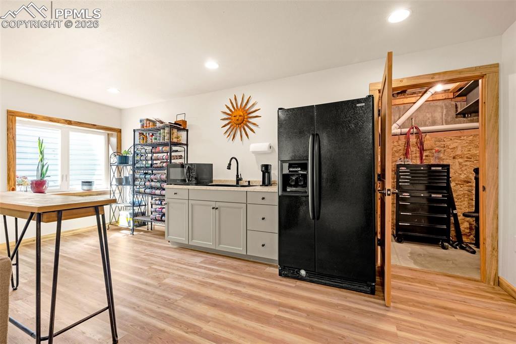 8480 Delaware Road Colorado Springs, CO 80926 - Photo 25 of 49 Basement Kitchen with fridge, a gas line is installed for future use