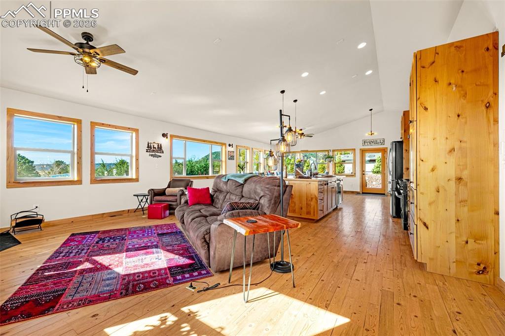 8480 Delaware Road Colorado Springs, CO 80926 - Photo 3 of 49 Living area with 13ft vaulted ceiling