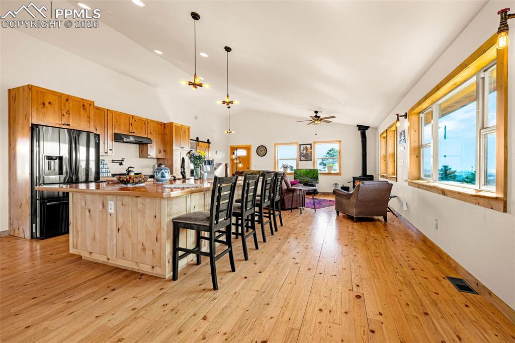 8480 Delaware Road Colorado Springs, CO 80926 - Photo 4 of 49 View of kitchen and living room in an open concept living